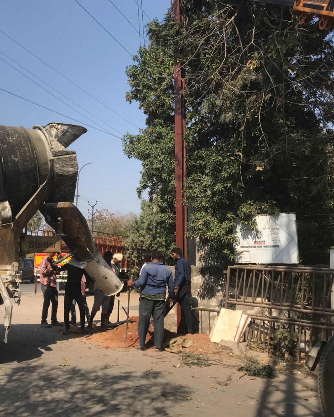 Men Working on Pole