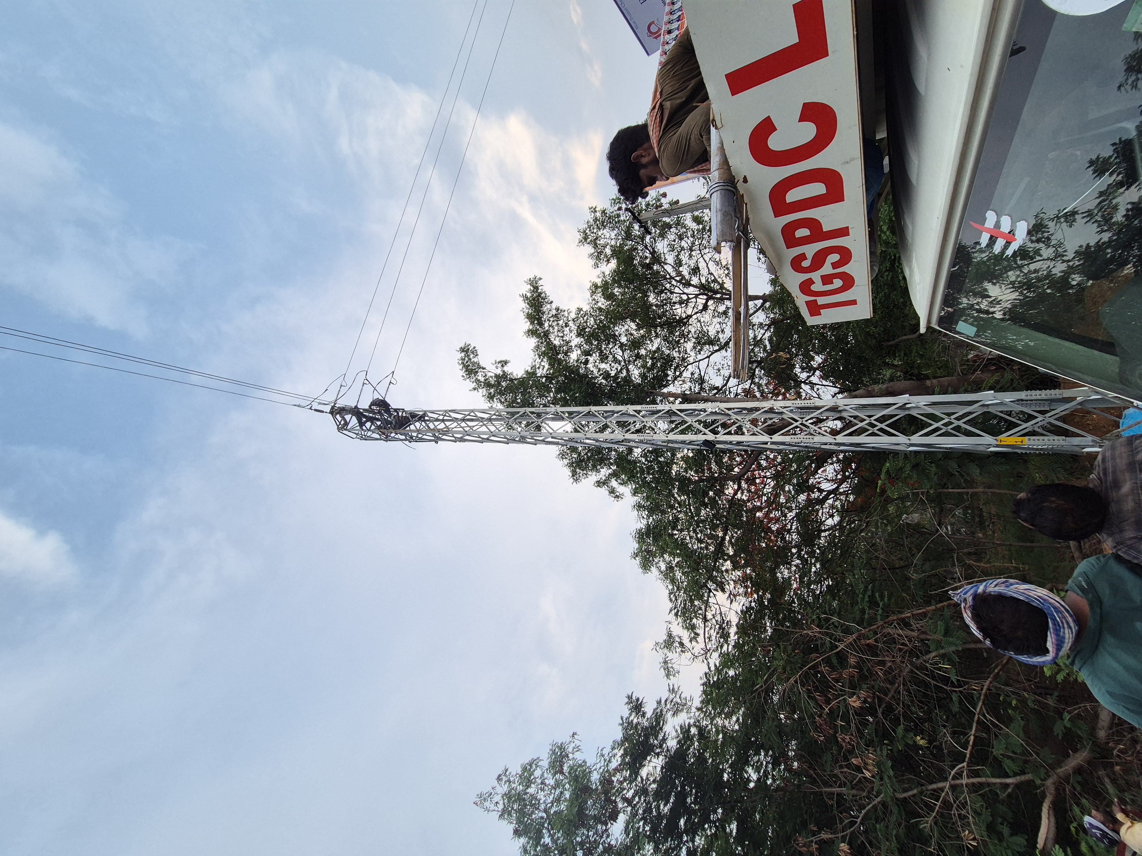 Men Working on Pole